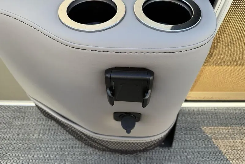 Slide: The Image of Cup holders and charging port on 2025 Barletta A20UC boat interior. - 13