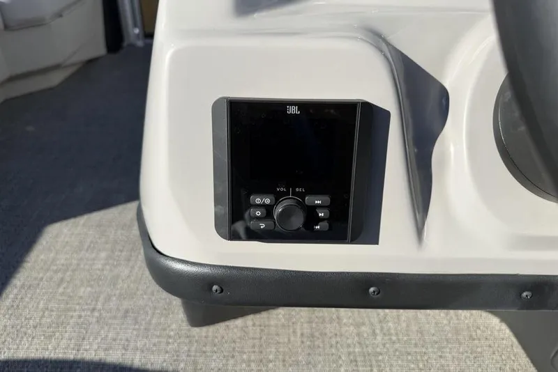 Slide: The Image of JBL audio system on 2025 Barletta A20UC boat dashboard. - 14