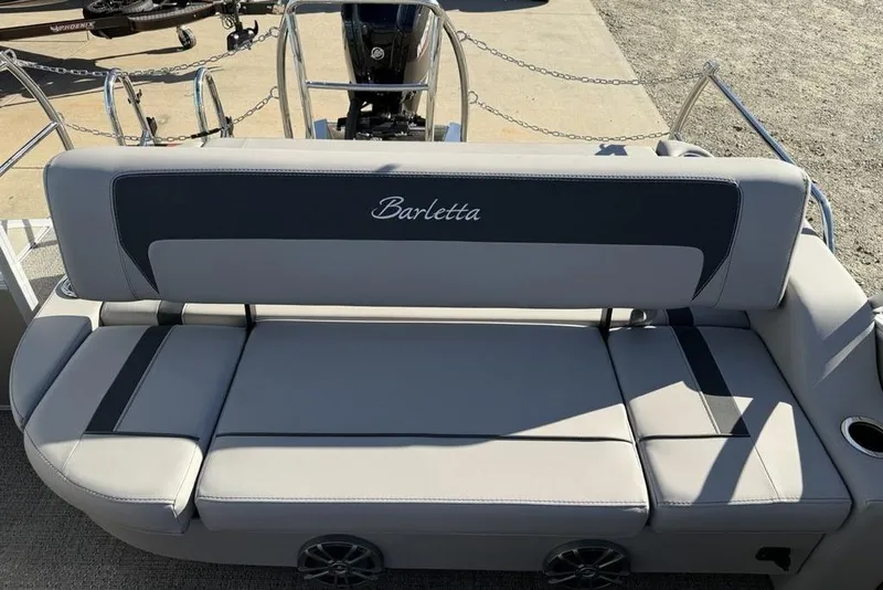 Slide: The Image of 2025 Barletta A20UC boat with sleek gray seating and modern design. - 20