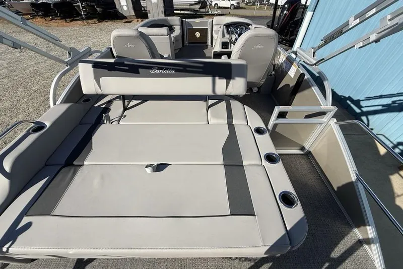 Slide: The Image of 2025 Barletta A20UC boat interior with spacious seating and cup holders. - 25