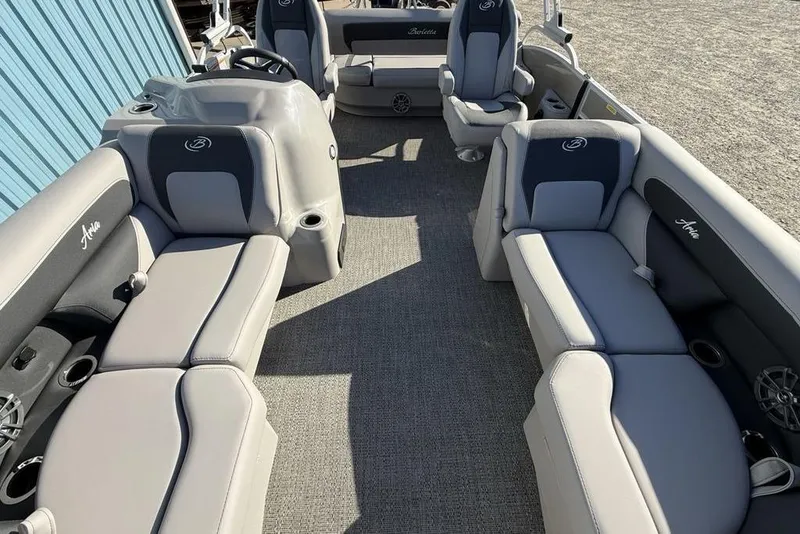 Slide: The Image of 2025 Barletta A20UC boat interior with gray seating and steering console. - 26