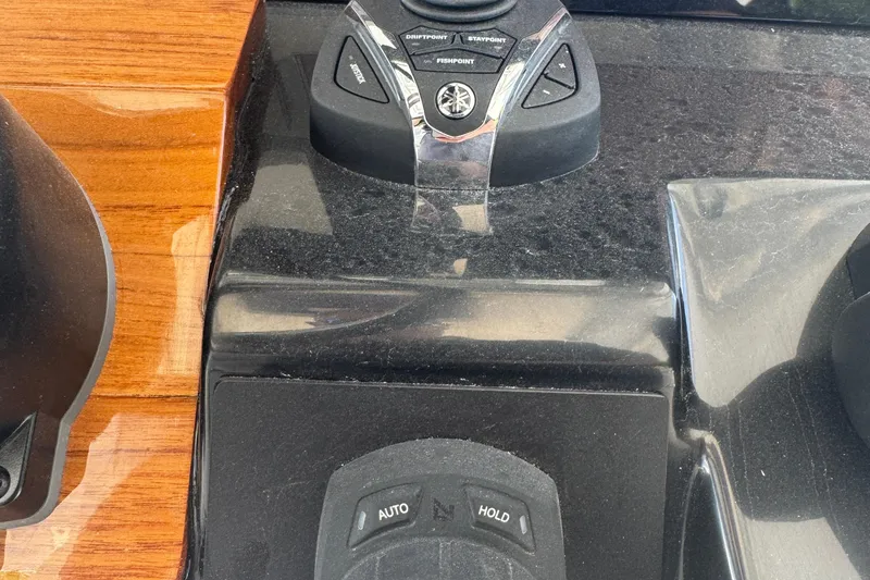 Slide: The Image of 2025 Robalo R300 Center Console dashboard controls with joystick and buttons. - 15