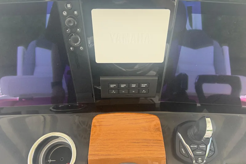 Slide: The Image of 2025 Robalo R300 Center Console dashboard with Yamaha controls and joystick. - 17