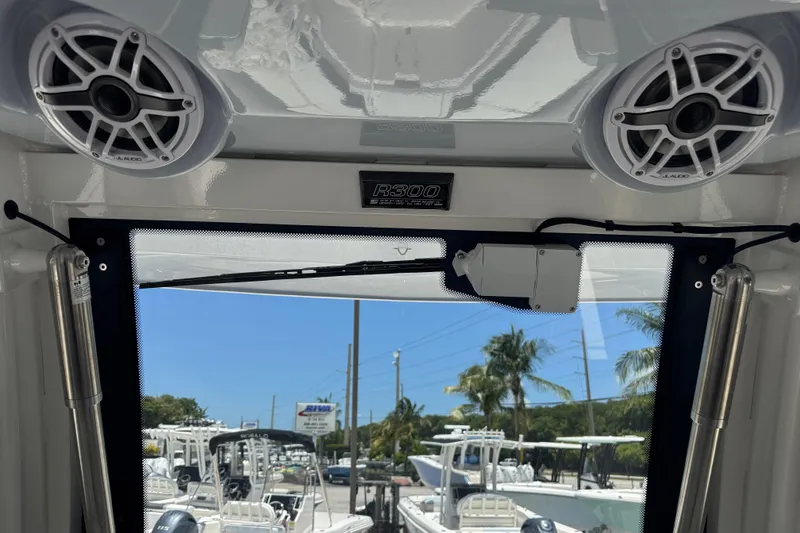Slide: The Image of 2025 Robalo R300 Center Console interior with speakers and windshield view. - 21