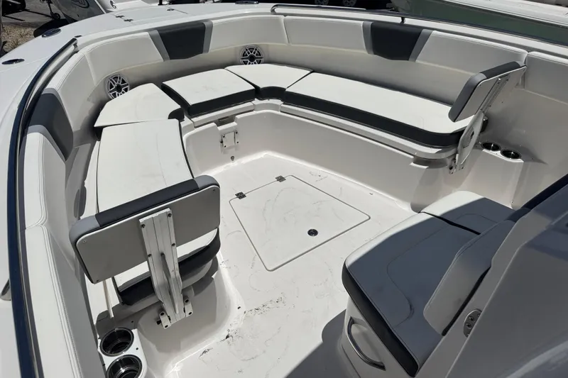 Slide: The Image of 2025 Robalo R300 Center Console boat interior with spacious seating and modern design. - 24