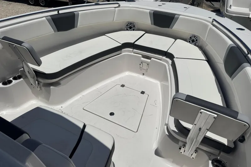 Slide: The Image of 2025 Robalo R300 Center Console boat with spacious seating and modern design. - 25