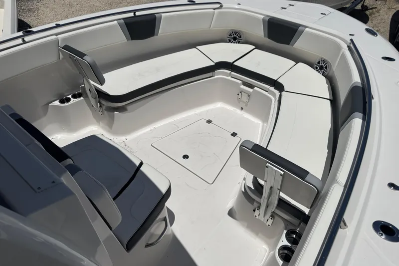 Slide: The Image of 2025 Robalo R300 Center Console boat with spacious seating and modern design. - 26