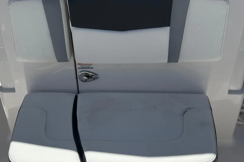 Slide: The Image of 2025 Robalo R300 Center Console boat seat with sleek white and gray design. - 28