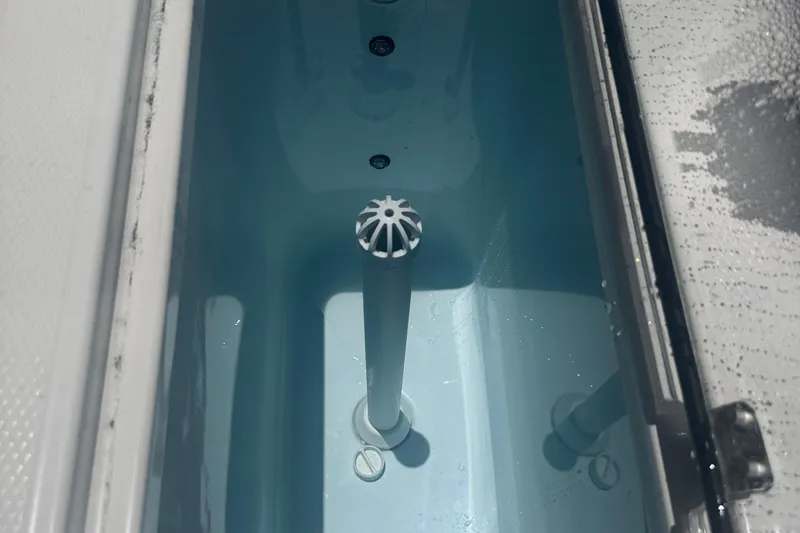 Slide: The Image of Livewell compartment in 2025 Robalo R300 Center Console boat. - 8