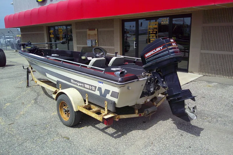 Slide: The Image of 1981 Ranger 1600 V-III boat with Mercury outboard motor on a trailer. - 3