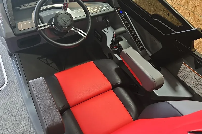 Slide: The Image of 2025 Trifecta Sport RF9 DC interior with red and black seating, modern steering wheel. - 10