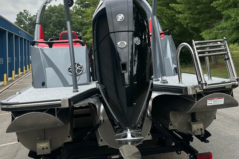 Slide: The Image of 2025 Trifecta Sport RF9 DC boat with powerful outboard motor and sleek design. - 15
