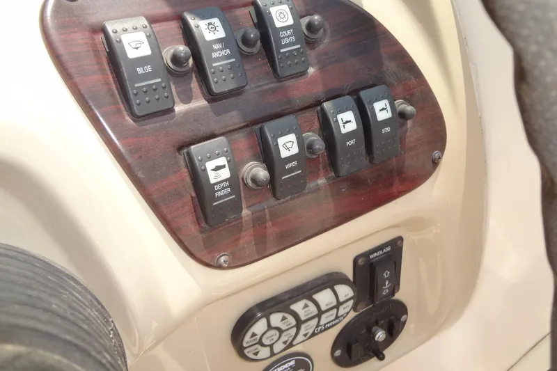 Slide: The Image of Control panel of a 2000 Chaparral Signature 260 boat with various switches. - 15