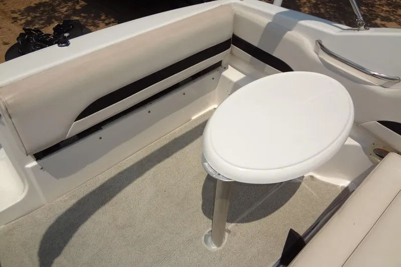 Slide: The Image of Interior of 2000 Chaparral Signature 260 boat with seating and table. - 17