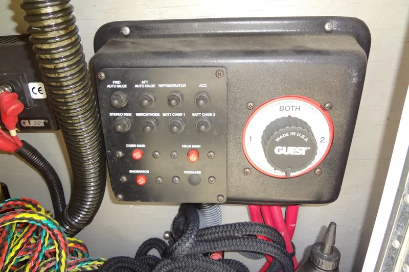 Slide: The Image of Control panel of a 2000 Chaparral Signature 260 boat with various switches and wiring. - 20