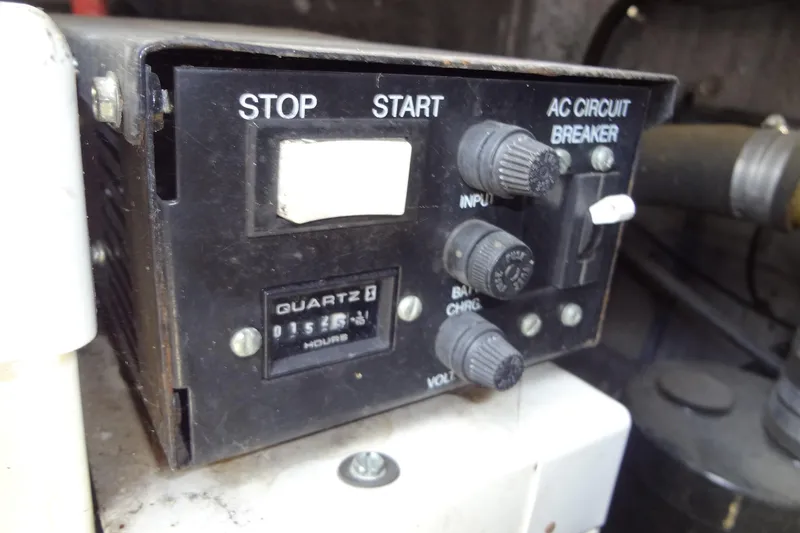 Slide: The Image of Control panel of a 2000 Chaparral Signature 260 boat with start, stop, and circuit breaker. - 31