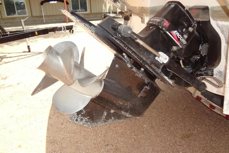 Slide: The Image of 2000 Chaparral Signature 260 boat with Mercury outboard motor and propeller. - 33