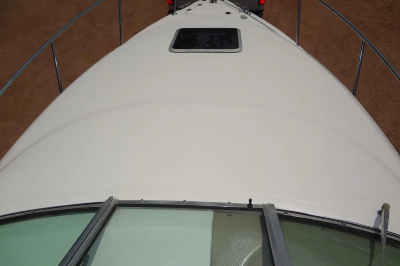 Slide: The Image of Bow view of 2000 Chaparral Signature 260 boat with hatch and railing. - 9