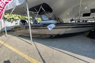 The Image of 2026 Smoker Craft 210 GLS Sport boat displayed under a tent. - 1