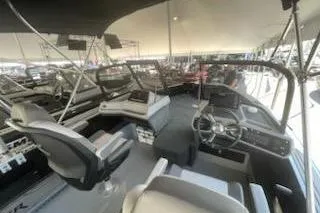 Slide: The Image of 2026 Smoker Craft 210 GLS SPORT boat interior with modern steering and seating. - 3