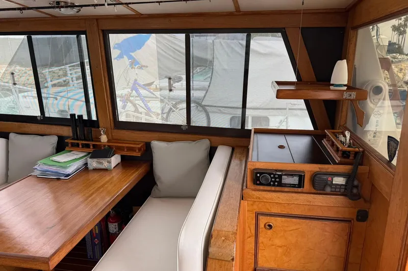 Slide: The Image of Interior of a 1979 Pacific Bluefin Sportfisher boat with wooden furnishings and navigation equipment. - 5