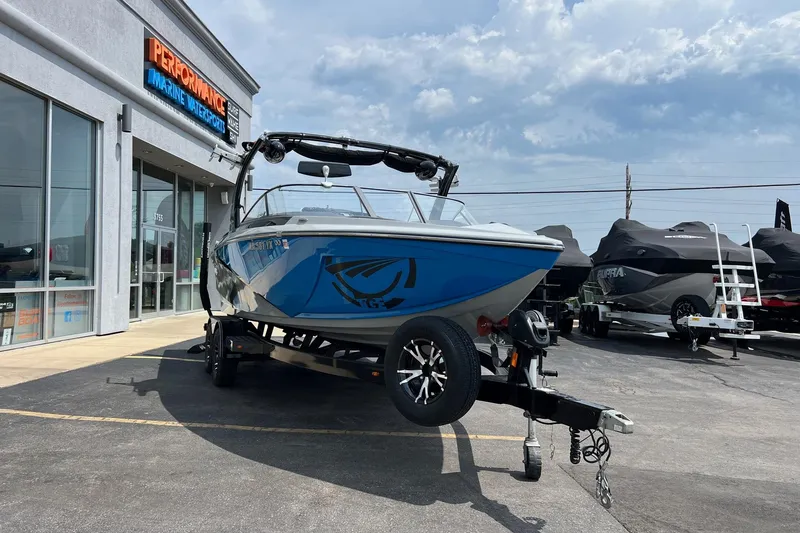 Slide: The Image of 2016 Tigé Z1 boat on trailer outside Performance Marine Watersports store. - 6