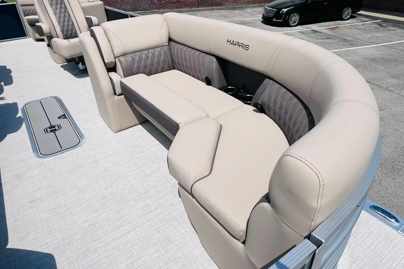 Slide: The Image of Luxurious seating on 2026 Harris Cruiser Sunliner 250 CW boat, featuring plush beige upholstery. - 14