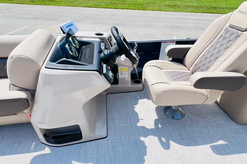 Slide: The Image of Luxurious helm of 2026 Harris Cruiser Sunliner 250 CW boat with plush seating. - 18