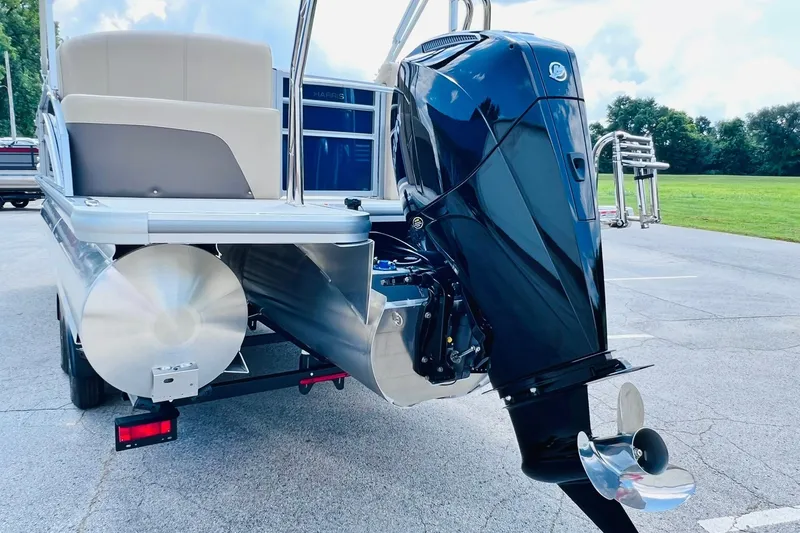 Slide: The Image of 2026 Harris Cruiser Sunliner 250 CW with 200HP engine, rear view on pavement. - 35