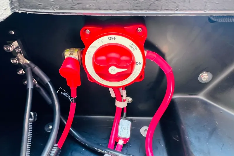 Slide: The Image of Red battery switch in Harris Cruiser Sunliner 250 CW 200HP, 2026 model. - 40
