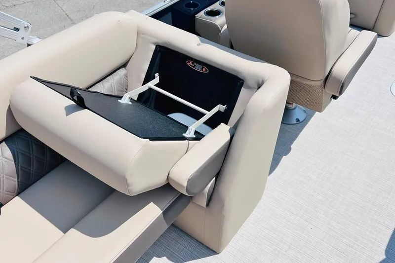 Slide: The Image of Luxurious seating on 2026 Harris Cruiser Sunliner 250 CW boat, featuring integrated storage. - 42