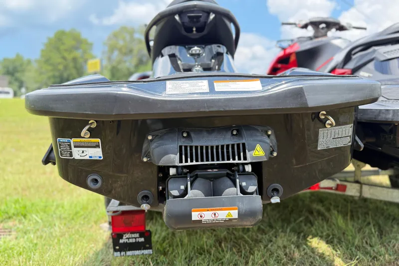 Slide: The Image of 2014 Sea-Doo RXT-X 260 jet ski rear view on grass, showcasing engine details. - 12