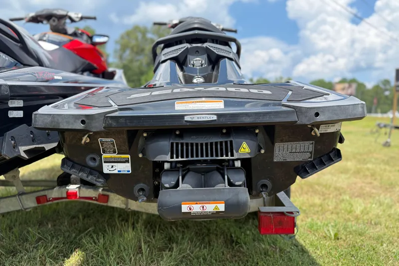 Slide: The Image of 2014 Sea-Doo RXT-X 260 jet ski rear view on trailer, outdoors. - 22