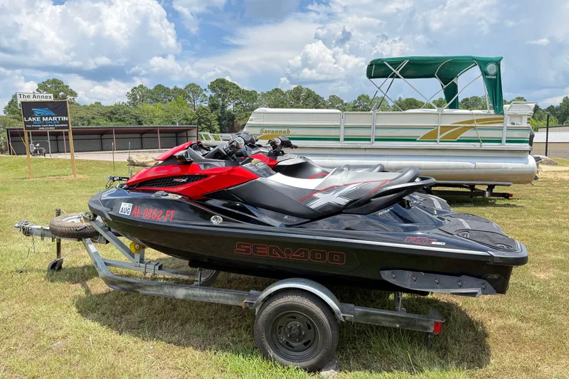 Slide: The Image of 2014 Sea-Doo RXT-X 260 jet ski on trailer, parked near Lake Martin. - 4
