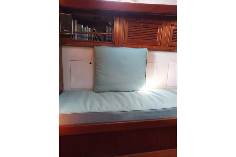 Slide: The Image of Interior of a 1978 Baba Cutter with cushioned seating and wooden cabinetry. - 5