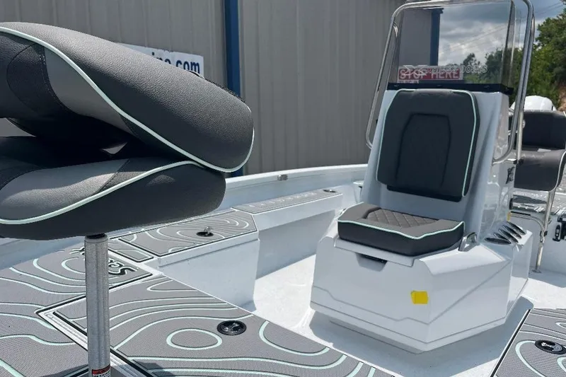 Slide: The Image of 2026 Xpress H20 BAY boat interior with modern seating and sleek design. - 4