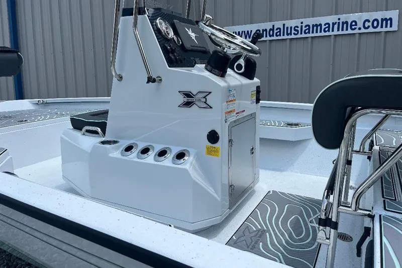 Slide: The Image of 2026 Xpress H20 BAY boat interior with steering console and seating. - 5