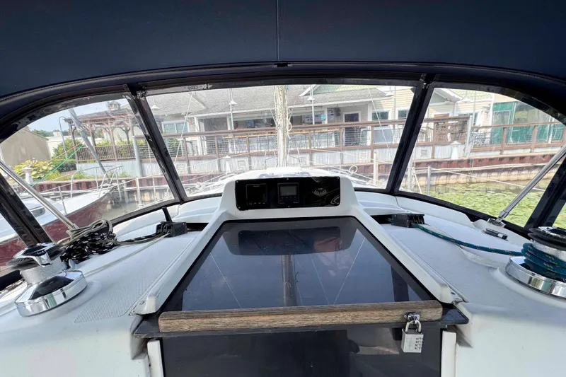 Slide: The Image of Interior view of a 1995 Hunter 336 sailboat cockpit with navigation equipment. - 11
