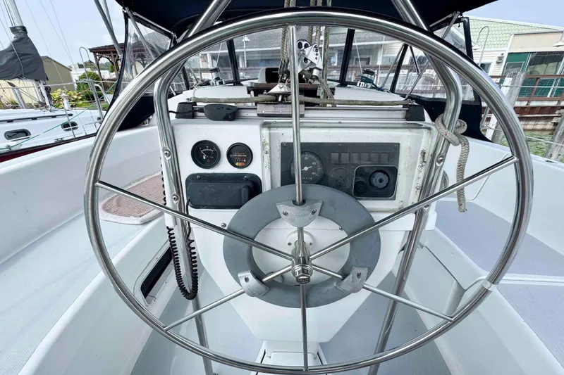 Slide: The Image of Steering wheel and dashboard of a 1995 Hunter 336 sailboat. - 8