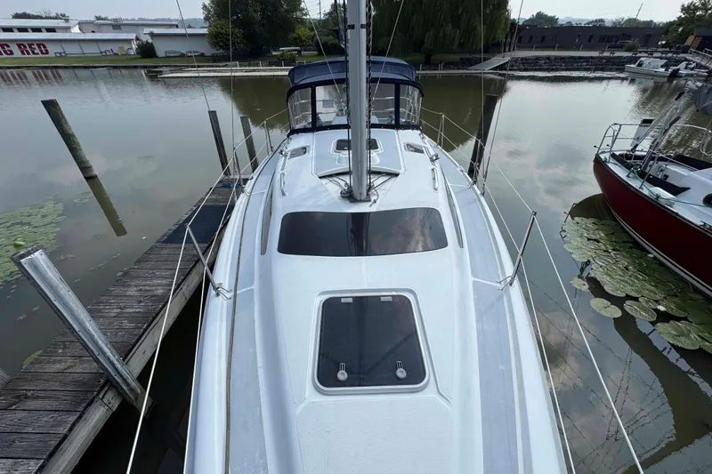 Slide: The Image of Sailboat docked at marina, Hunter 336 model, 1995, calm water, overcast sky. - 9
