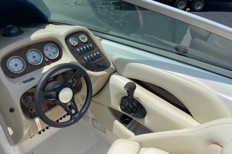 Slide: The Image of 2005 Chaparral 256 SSi boat dashboard with steering wheel and control panel. - 7