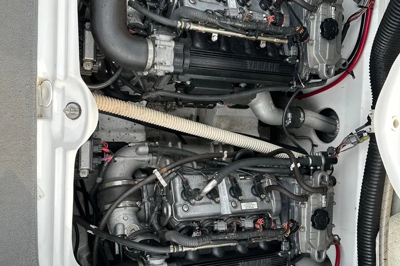Slide: The Image of Engine compartment of a 2015 Yamaha Boats AR210, showcasing dual engines and components. - 5