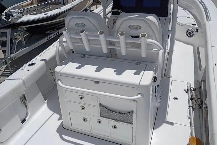 Slide: The Image of 2021 Sportsman Open 282 Center Console boat with luxurious white seating. - 10