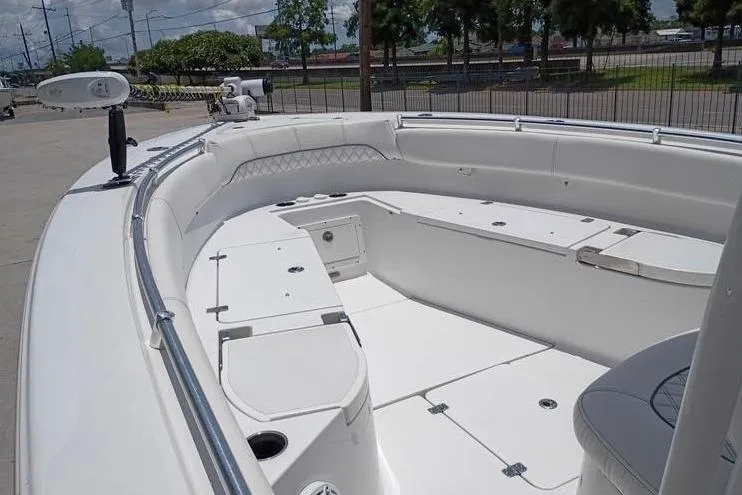 Slide: The Image of 2021 Sportsman Open 282 Center Console boat with Garmin equipment, docked on concrete. - 17