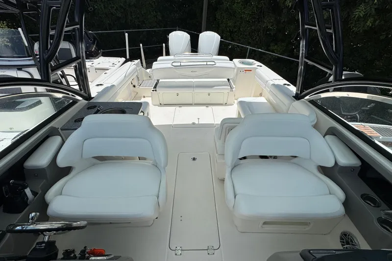Slide: The Image of 2021 Robalo R317 Dual Console boat interior with white seating and modern design. - 13