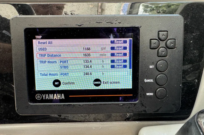 Slide: The Image of Yamaha display on 2021 Robalo R317 Dual Console showing trip data and settings. - 17