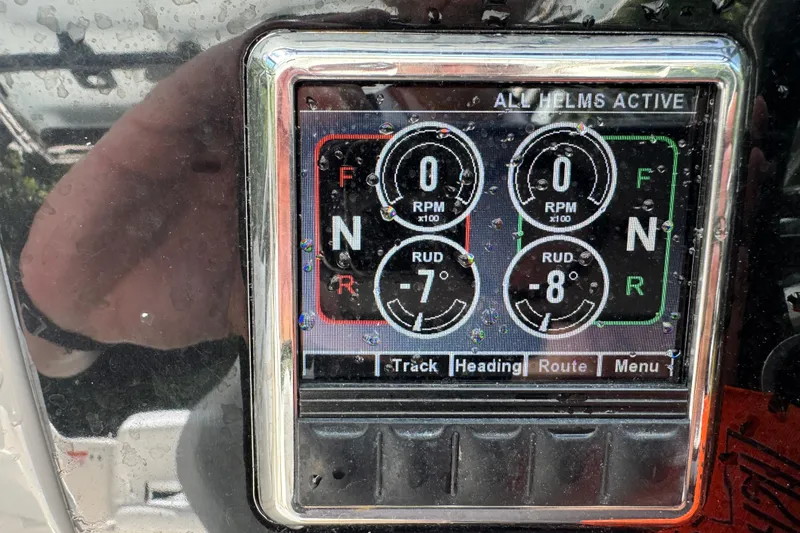 Slide: The Image of Display panel of 2021 Robalo R317 Dual Console boat showing RPM and rudder settings. - 20