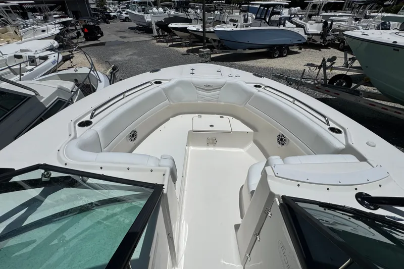 Slide: The Image of 2021 Robalo R317 Dual Console boat with spacious seating and sleek design. - 7