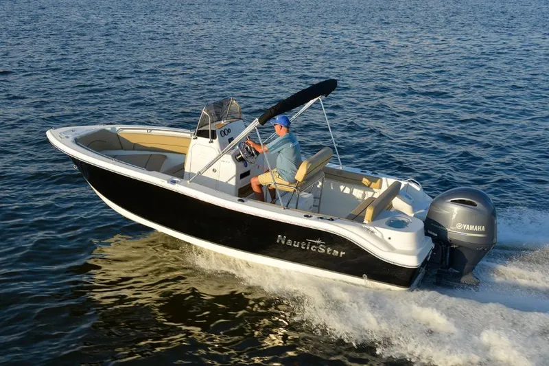 Slide: The Image of Manufacturer Provided Image: 2020 NauticStar 20 XS Offshore boat cruising on water. - 10
