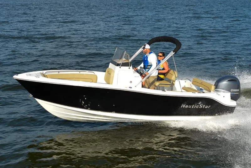 Slide: The Image of Manufacturer Provided Image: 2020 NauticStar 20 XS Offshore boat cruising on open water. - 11
